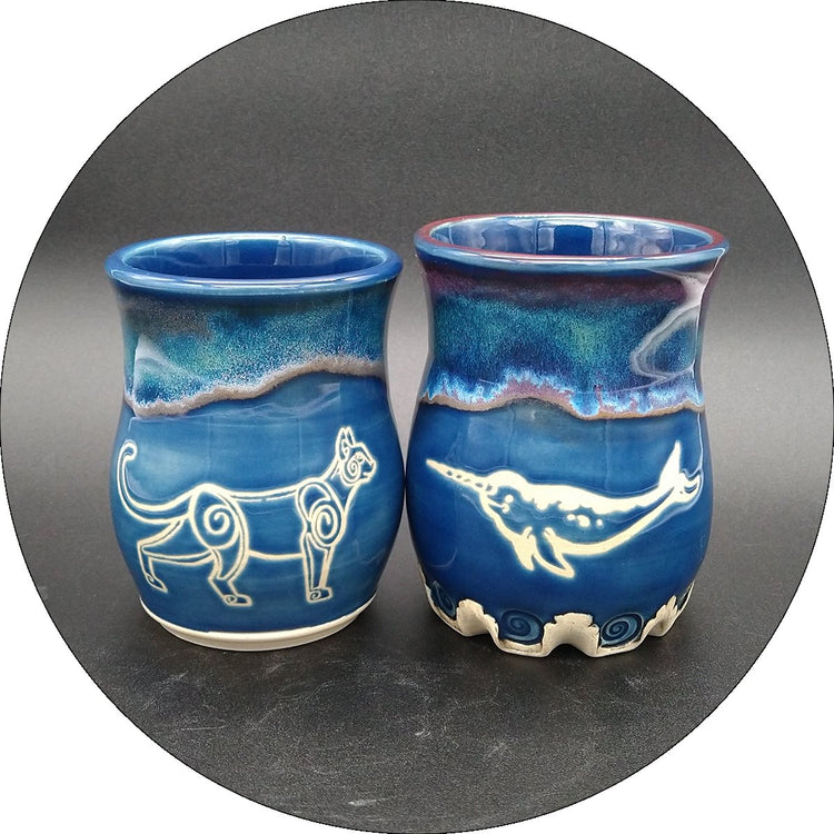 Three cups with original raven artwork